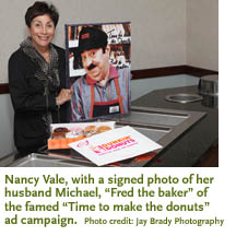 Photo of Nancy Vale with a signed photo of Michael 